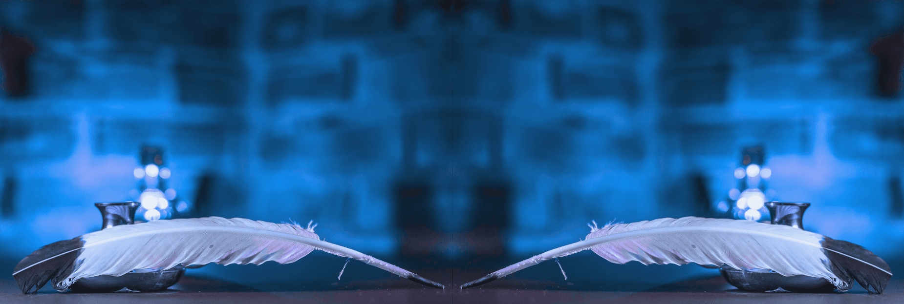 Quill on paper witth an ethereal bluish lighting